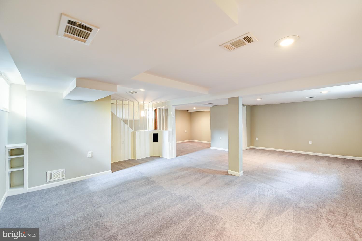 12816 Matey Road Silver Spring, MD 20906 - Photo 18 of 30 an empty room with windows and painted walls