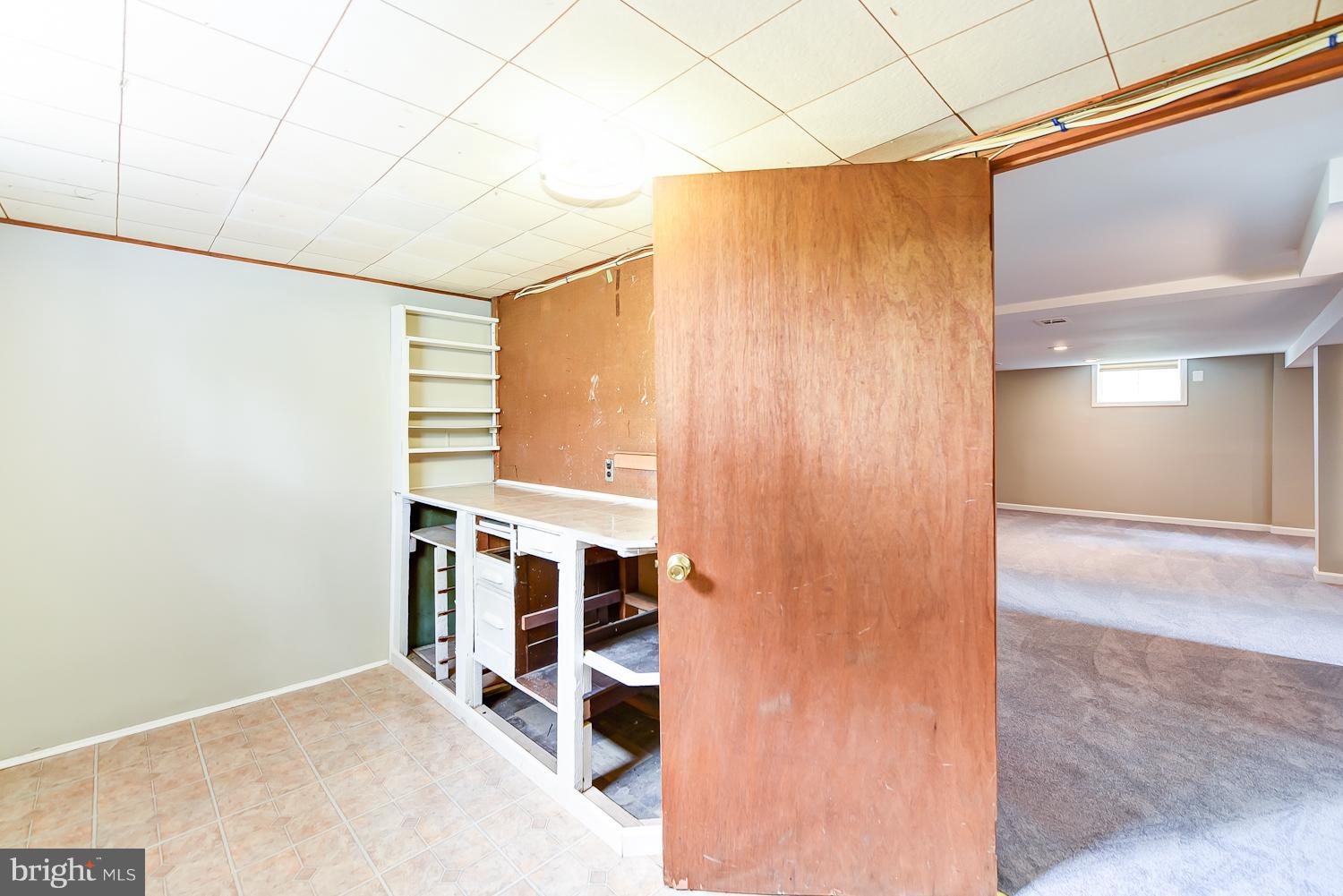 12816 Matey Road Silver Spring, MD 20906 - Photo 21 of 30 a view of a room with wooden floor and windows