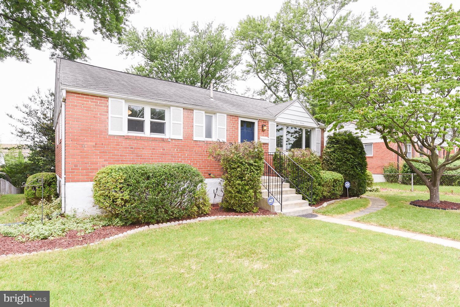 12816 Matey Road Silver Spring, MD 20906 - Photo 23 of 30 front view of a house with a yard