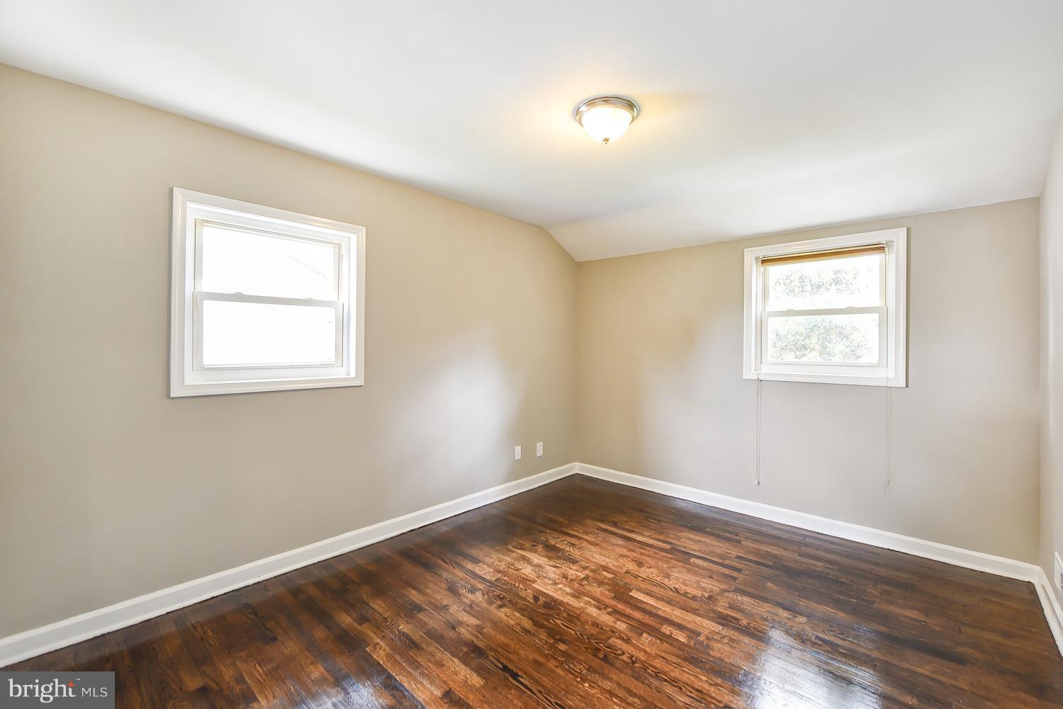 12816 Matey Road Silver Spring, MD 20906 - Photo 10 of 30 a view of a room with wooden floor and windows