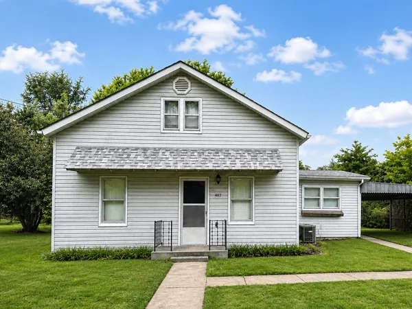 a front view of a house with a yard