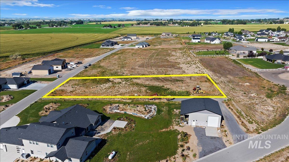 72 Victoria Street Jerome, ID 83338 - Photo 7 of 16 Aerial view of sparsely populated area with property boundaries highlighted and nearby suburban area