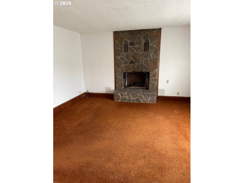 415 South 32nd Street Springfield, OR 97478 - Photo 2 of 10 a view of an empty room with a fireplace