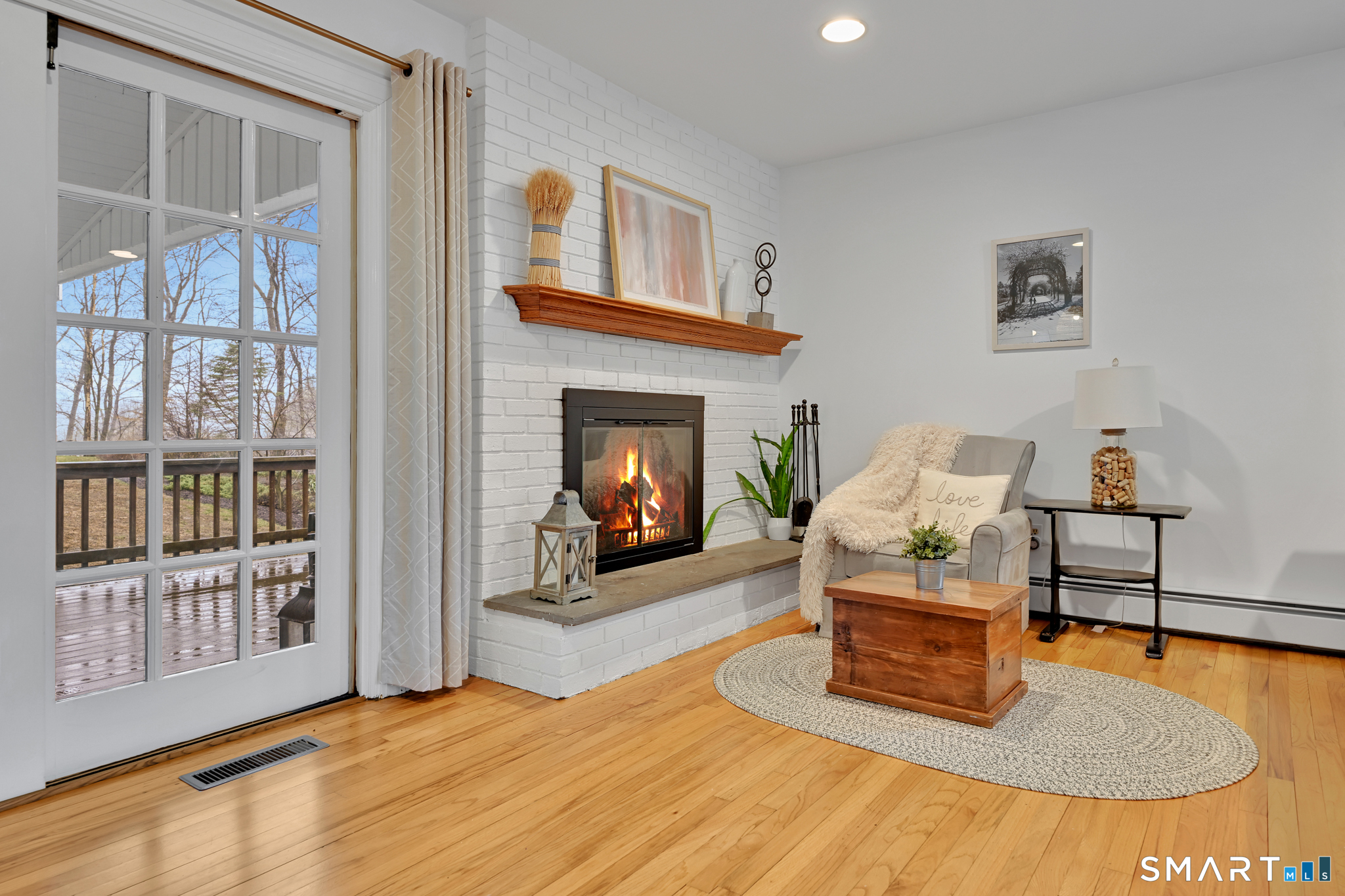 117 Settlers Farm Road Monroe, CT 06468 - Photo 14 of 40 A detailed wood-burning fireplace is a focal point of the room.