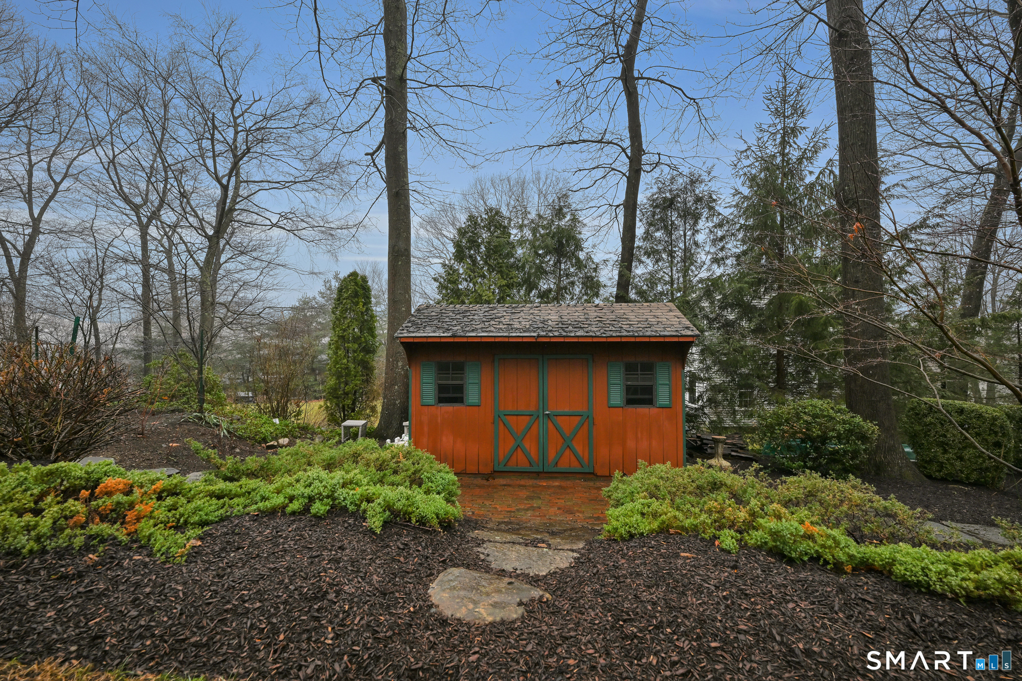 117 Settlers Farm Road Monroe, CT 06468 - Photo 30 of 40 The barn-like shed serves as both practical storage space and a delightful focal point.