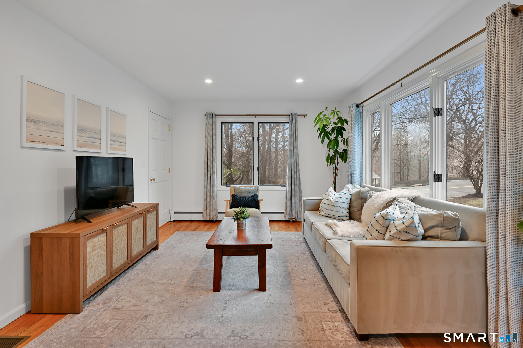 117 Settlers Farm Road Monroe, CT 06468 - Photo 3 of 40 Step into the spacious living room, where natural light pours in, illuminating the hard wood floors throughout.