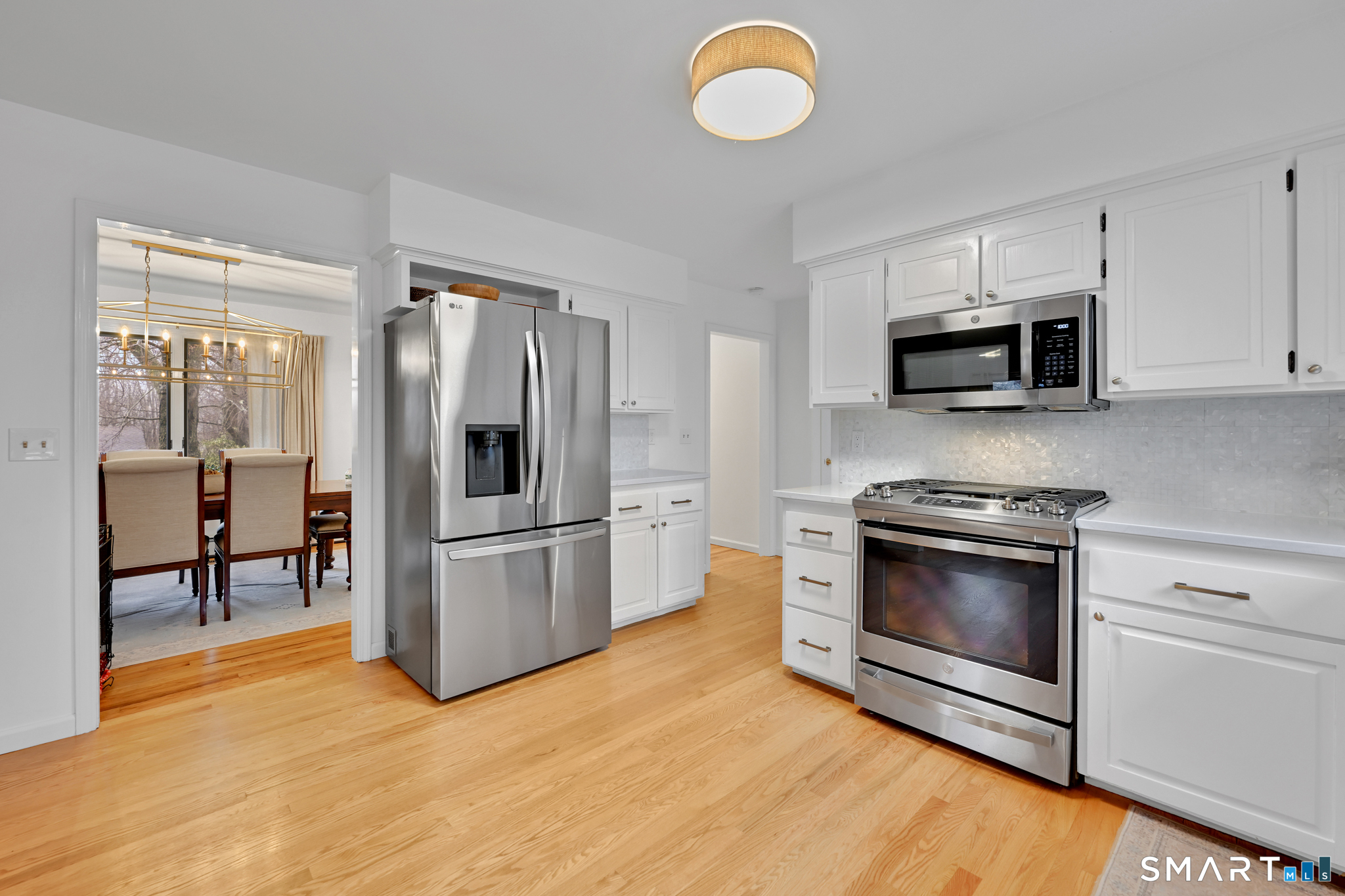 117 Settlers Farm Road Monroe, CT 06468 - Photo 9 of 40 Equipped with a six burner gas stove and stainless steel appliances, this kitchen combines modern convenience with style.
