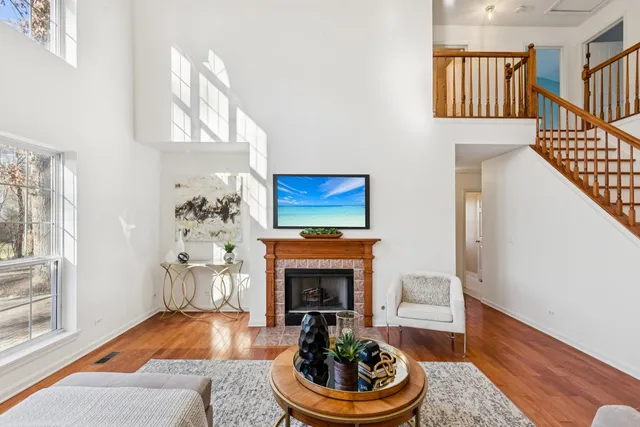 a living room with furniture a window and a fireplace