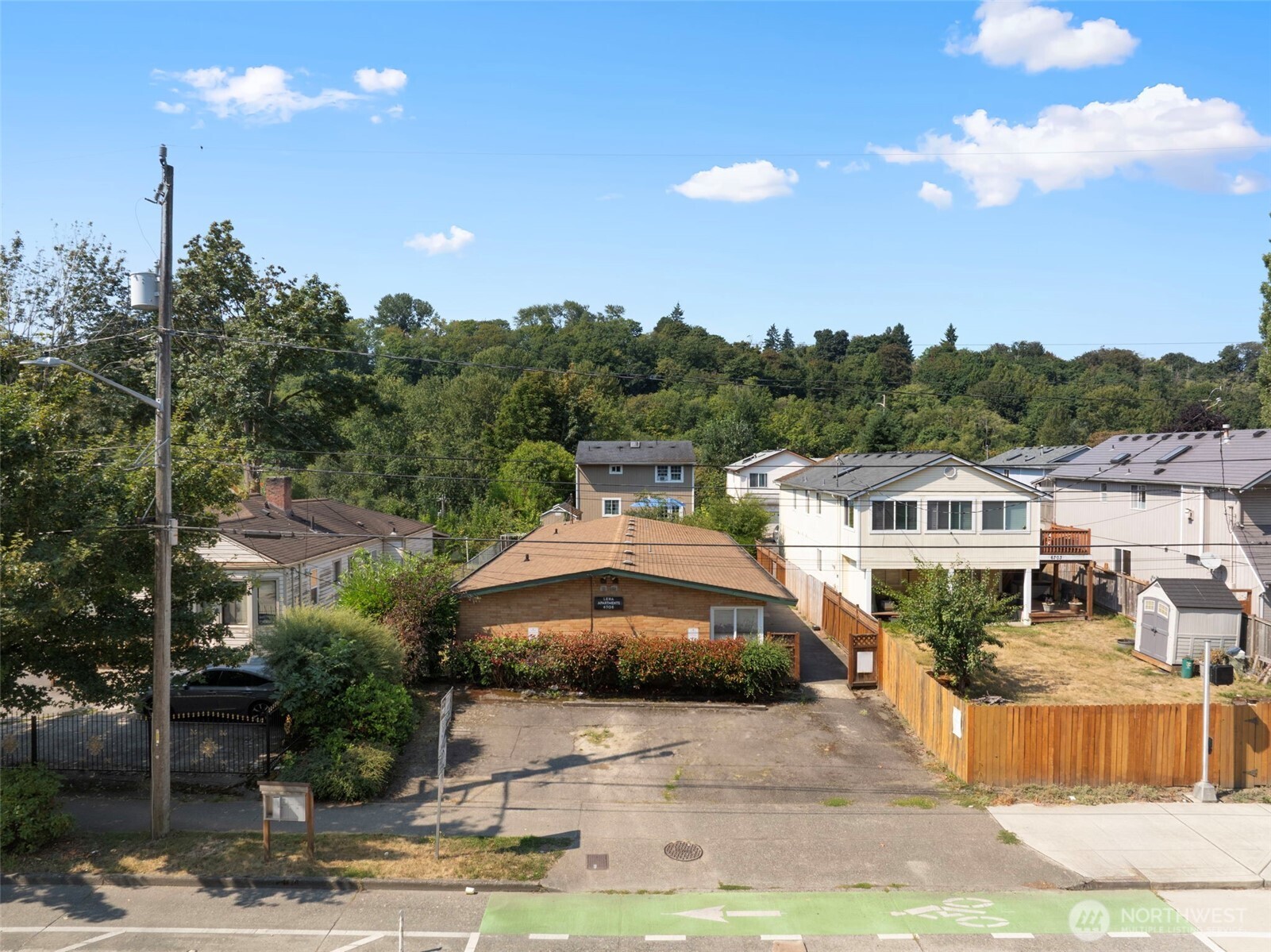 6705 Delridge Way Southwest Seattle, WA 98106 - Photo 1 of 21 a front view of a house with a garden
