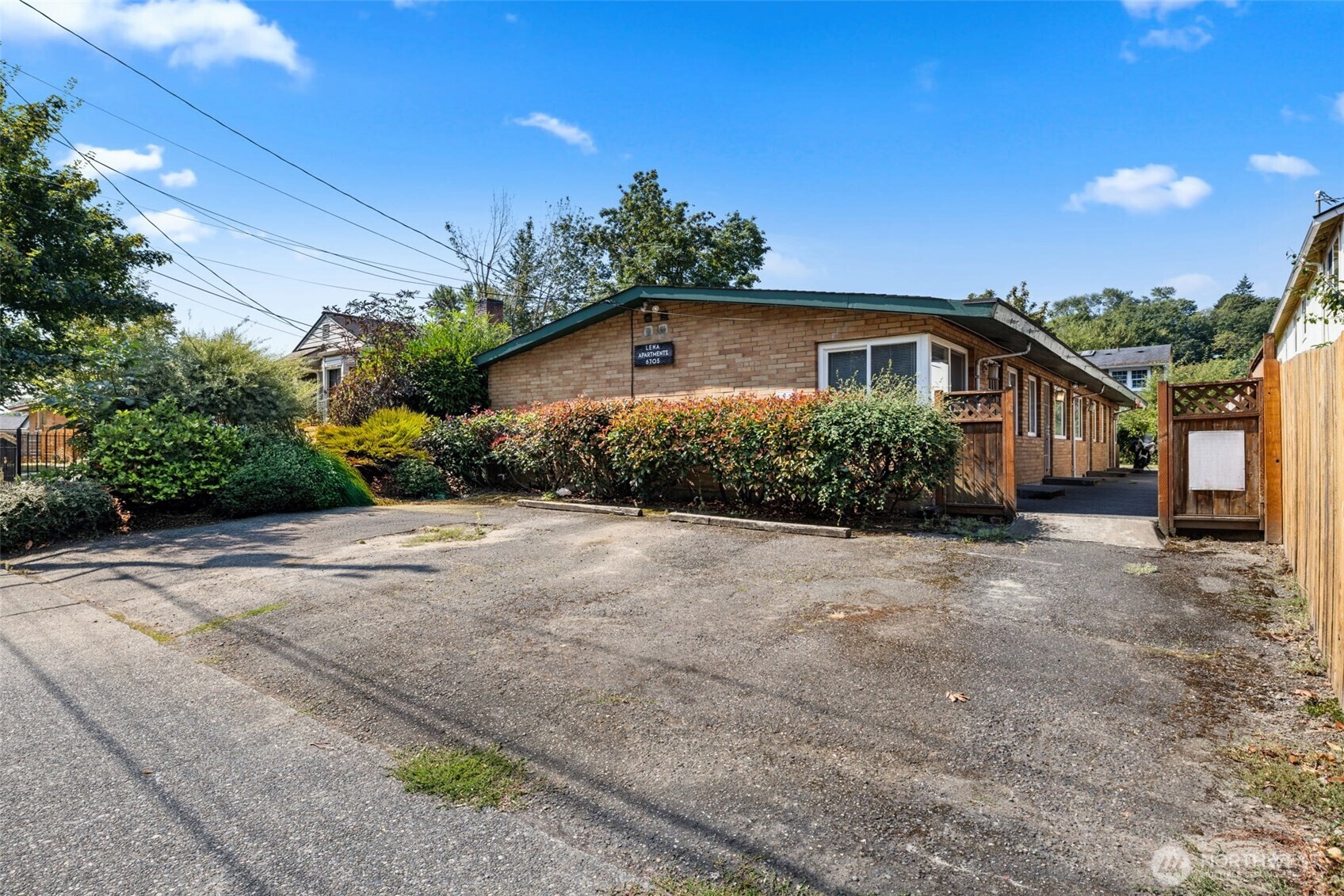 6705 Delridge Way Southwest Seattle, WA 98106 - Photo 4 of 21 a front view of a house with a yard and potted plants