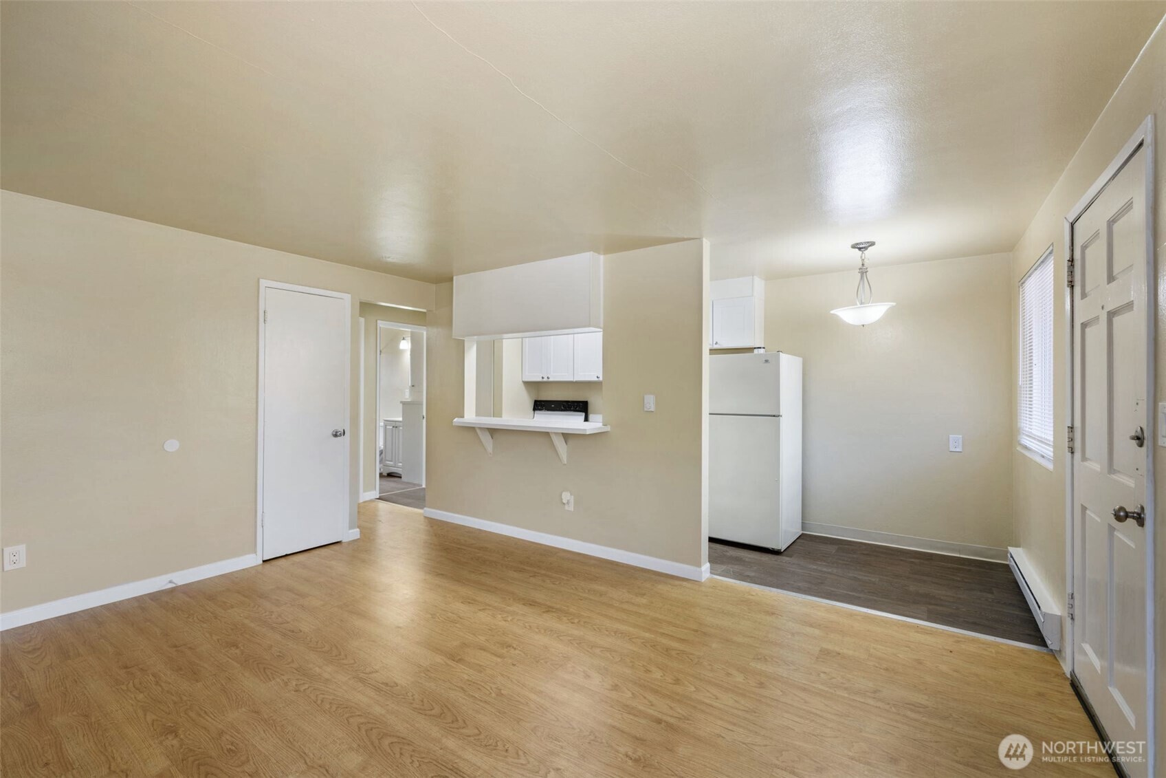 6705 Delridge Way Southwest Seattle, WA 98106 - Photo 6 of 21 a view of a kitchen with a refrigerator and a sink