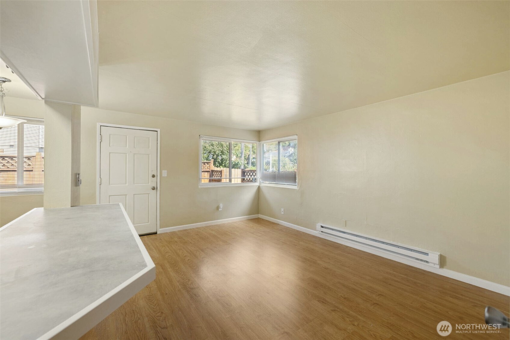 6705 Delridge Way Southwest Seattle, WA 98106 - Photo 9 of 21 an empty room with windows