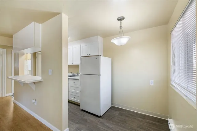 a kitchen with a refrigerator and countertop