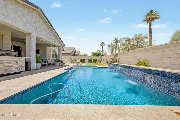 a backyard with a table and chairs
