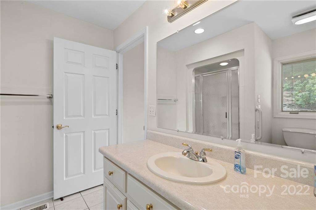 428 Smith Road Columbus, NC 28722 - Photo 15 of 48 a bathroom with a sink and a mirror