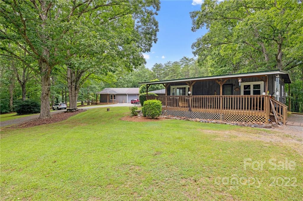 428 Smith Road Columbus, NC 28722 - Photo 33 of 48 a front view of a house with garden