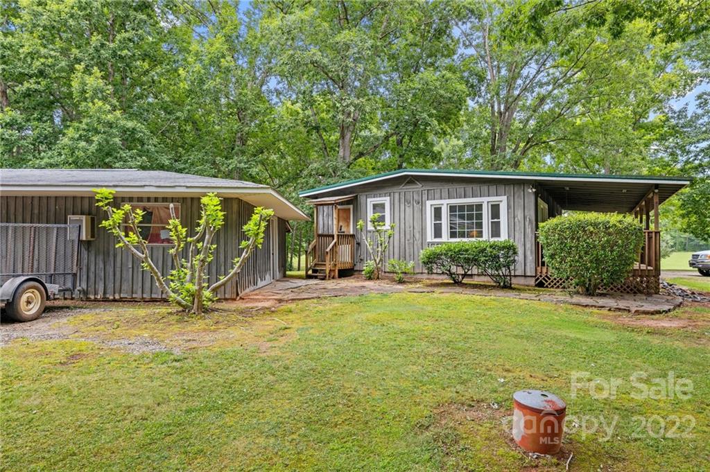 428 Smith Road Columbus, NC 28722 - Photo 34 of 48 a view of a house with backyard and sitting area