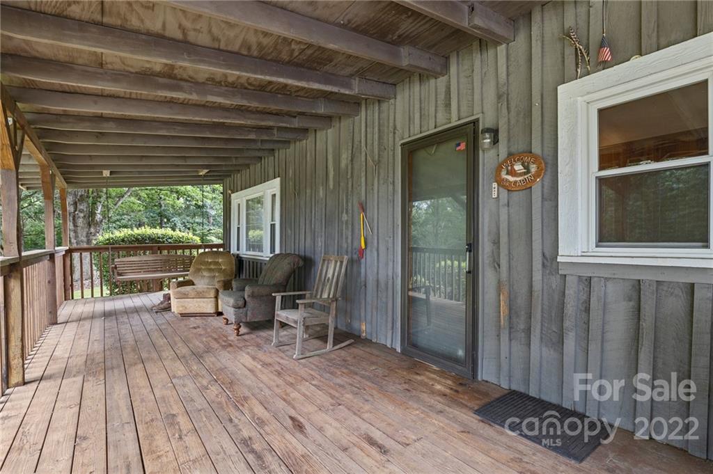 428 Smith Road Columbus, NC 28722 - Photo 35 of 48 a balcony with chairs and wooden floor