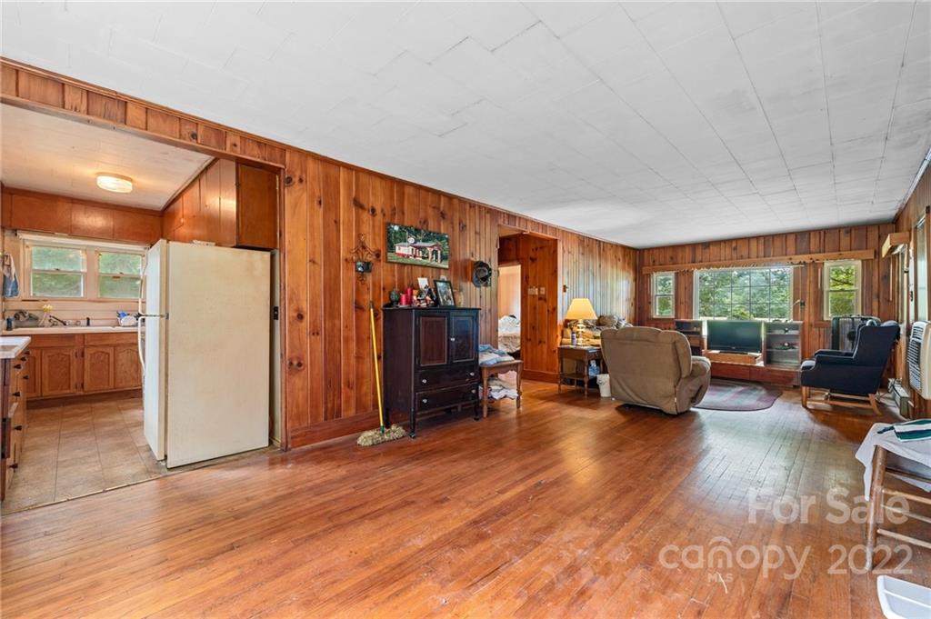 428 Smith Road Columbus, NC 28722 - Photo 36 of 48 a living room with furniture and a refrigerator