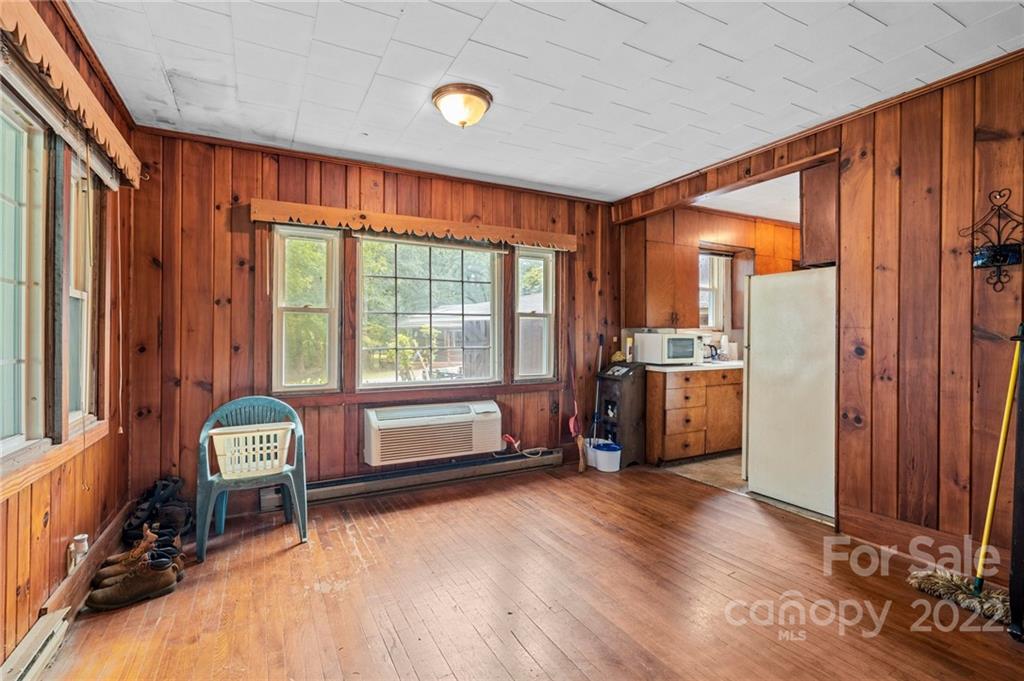 428 Smith Road Columbus, NC 28722 - Photo 38 of 48 a room with a bed and a chair