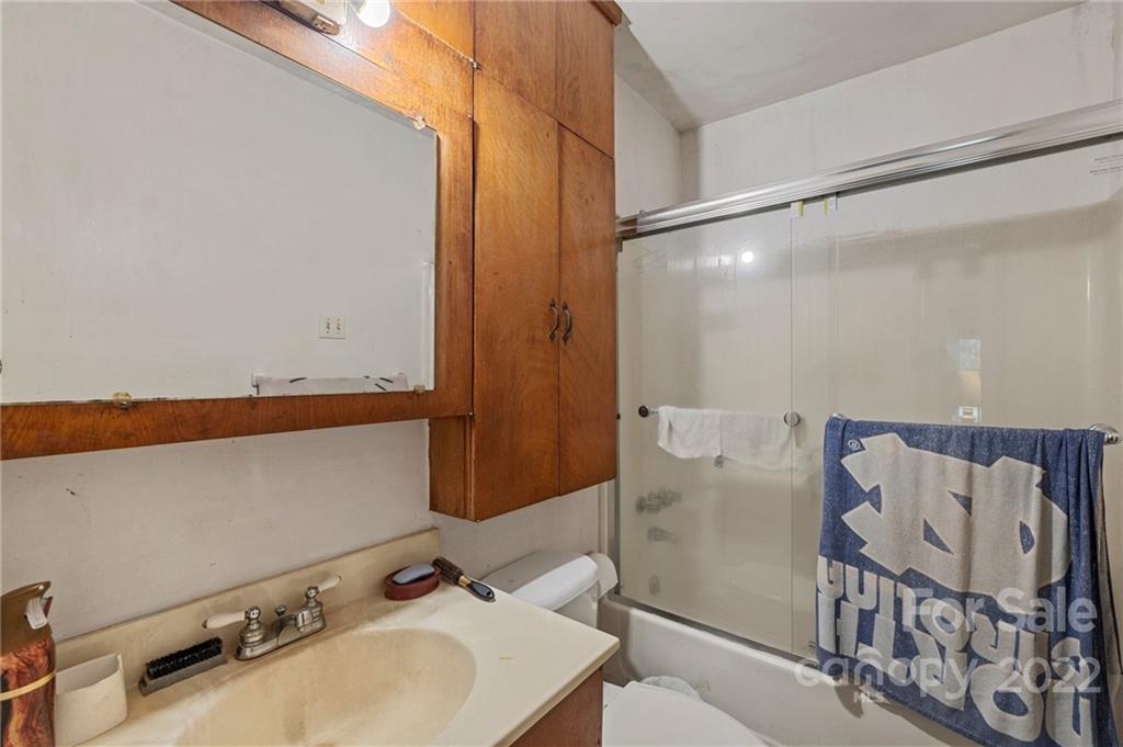 428 Smith Road Columbus, NC 28722 - Photo 41 of 48 a bathroom with a sink and a mirror