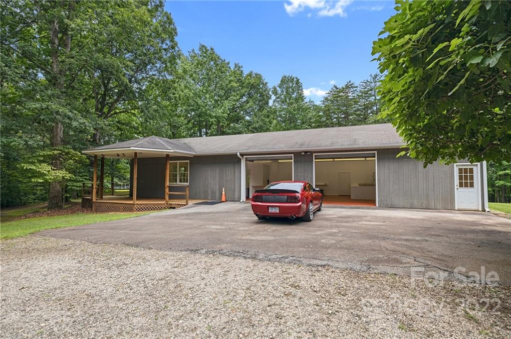 428 Smith Road Columbus, NC 28722 - Photo 43 of 48 a white house with a outdoor space