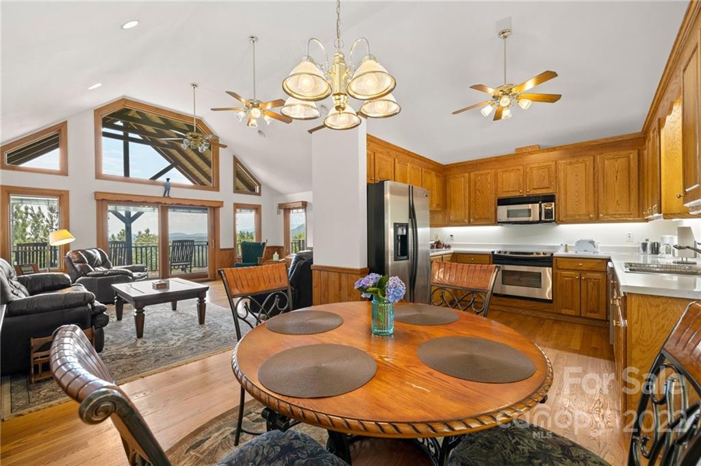 428 Smith Road Columbus, NC 28722 - Photo 10 of 48 a dining room filled chandelier and kitchen view