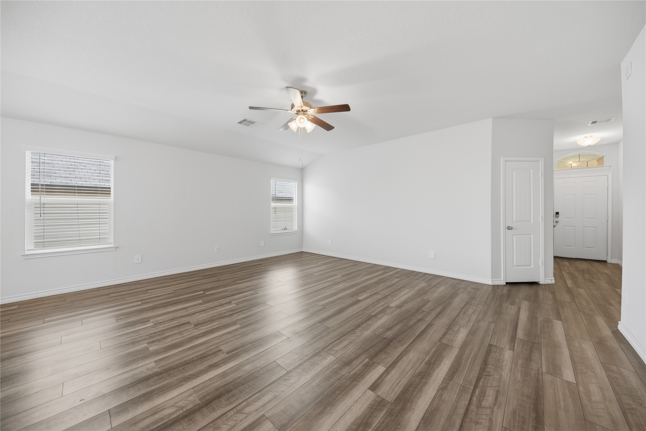 1010 Fannin Street Brenham, TX 77833 - Photo 20 of 30 wooden floor in an empty room with a window