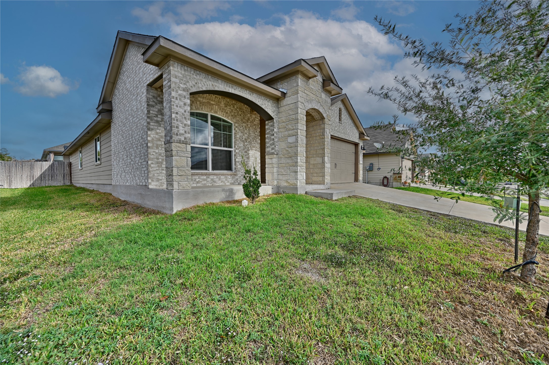 1010 Fannin Street Brenham, TX 77833 - Photo 2 of 30 a front view of a house with a yard