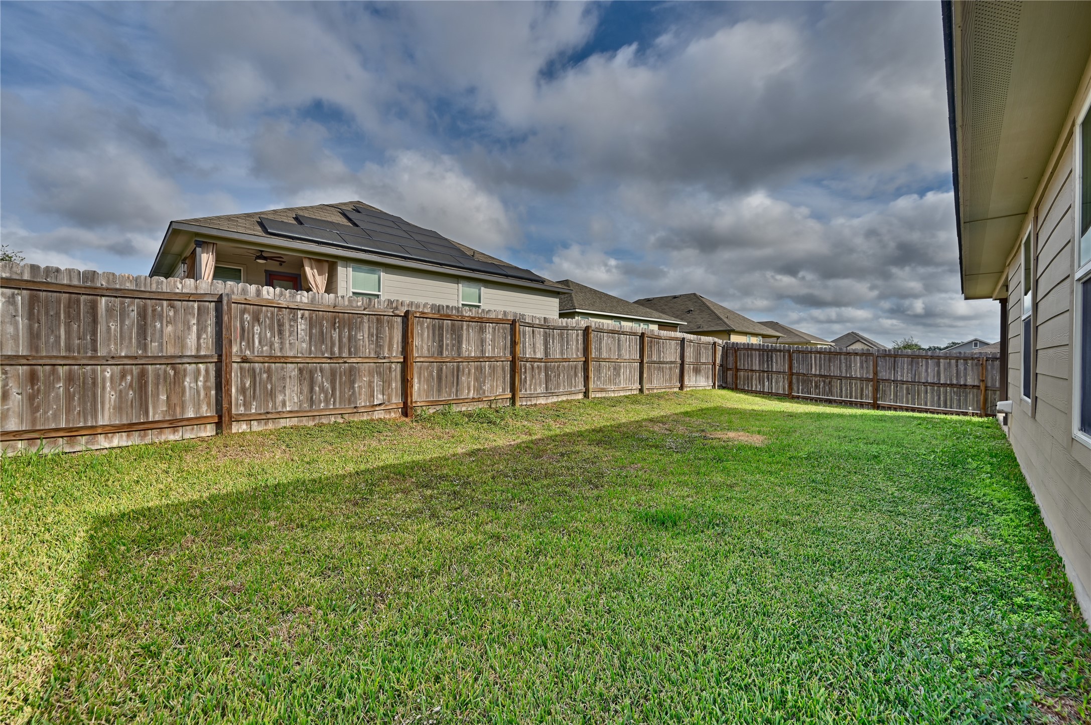 1010 Fannin Street Brenham, TX 77833 - Photo 7 of 30 a view of a house with a big yard and large trees