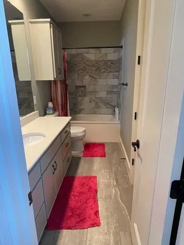 a bathroom with a bathtub and a shower