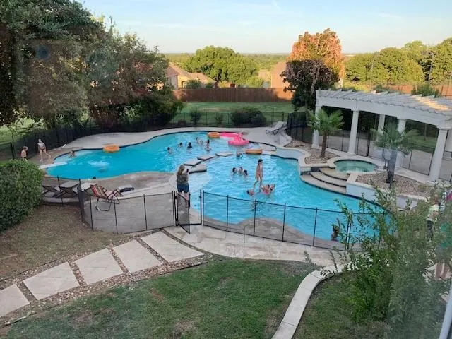 an outdoor sitting area with furniture and garden