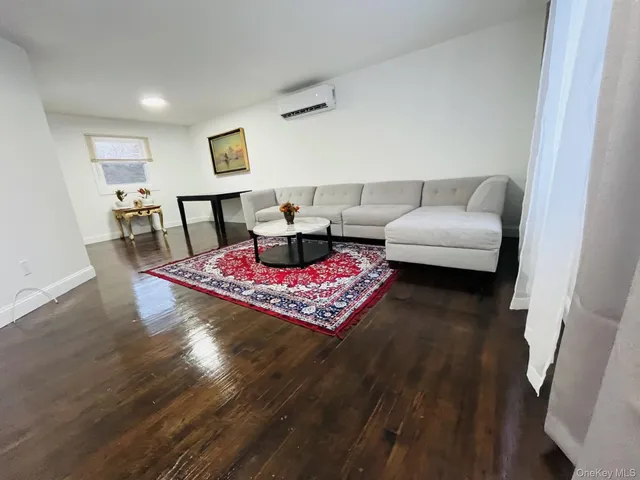 a living room with furniture and a rug