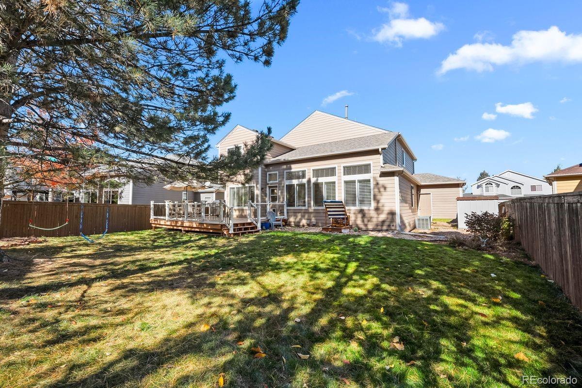 450 Bexley Lane Highlands Ranch, CO 80126 - Photo 33 of 41 a front view of a house with a yard