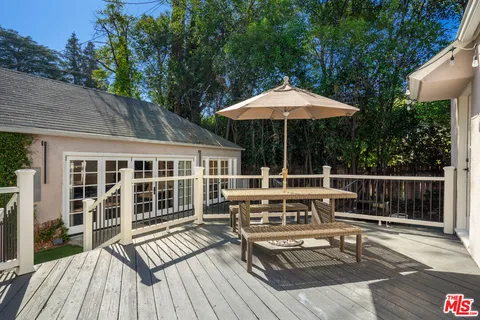 a view of roof deck with patio
