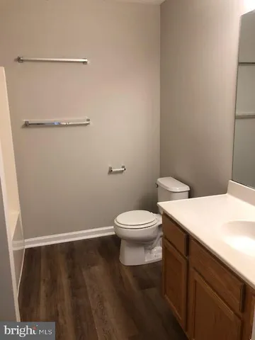 a bathroom with a toilet and a sink