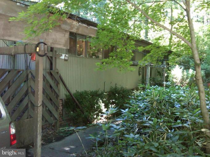 14901 River Road Potomac, MD 20854 - Photo 1 of 1 a view of a house with a yard