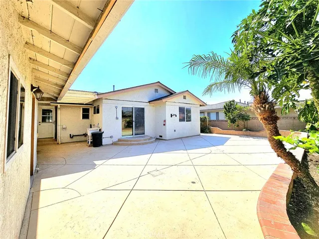 a view of a backyard of the house