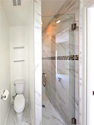 a spacious bathroom with a granite countertop sink and mirror