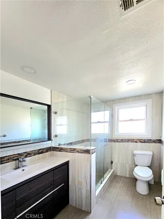 a view of a refrigerator in a kitchen