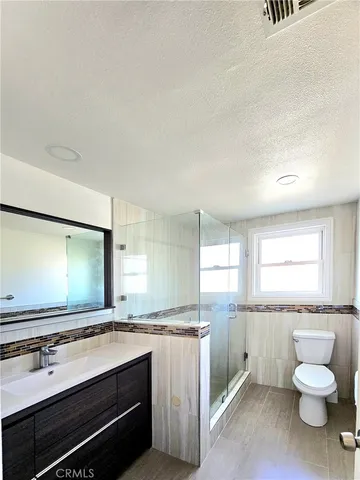 a view of a refrigerator in a kitchen