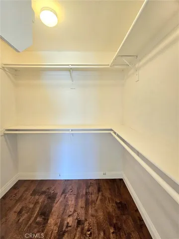 a view of hallway with wooden floor