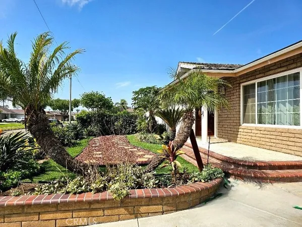 a house view with a garden space