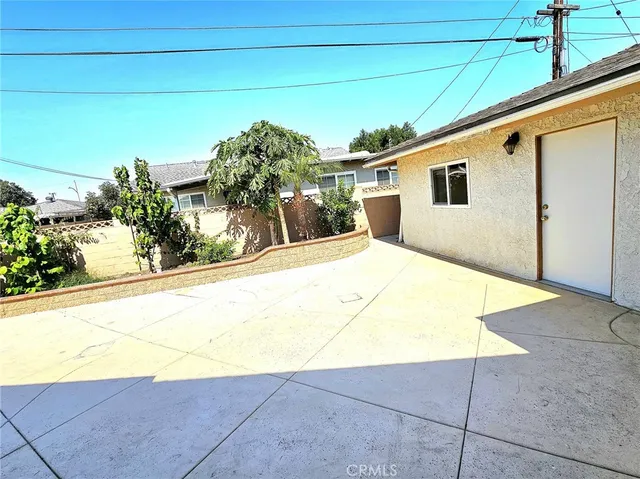 a view of backyard with potted plants