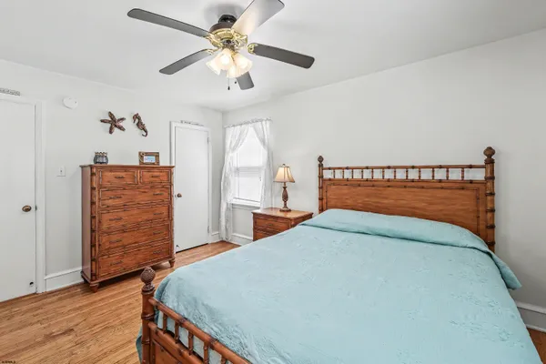 a bedroom with furniture and a book shelf