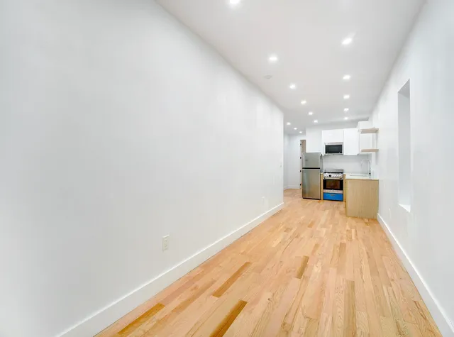 a view of kitchen with wooden floor