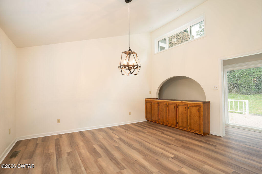 7 Timberlake Drive Jackson, TN 38305 - Photo 3 of 38 a view of a room with wooden floor and window
