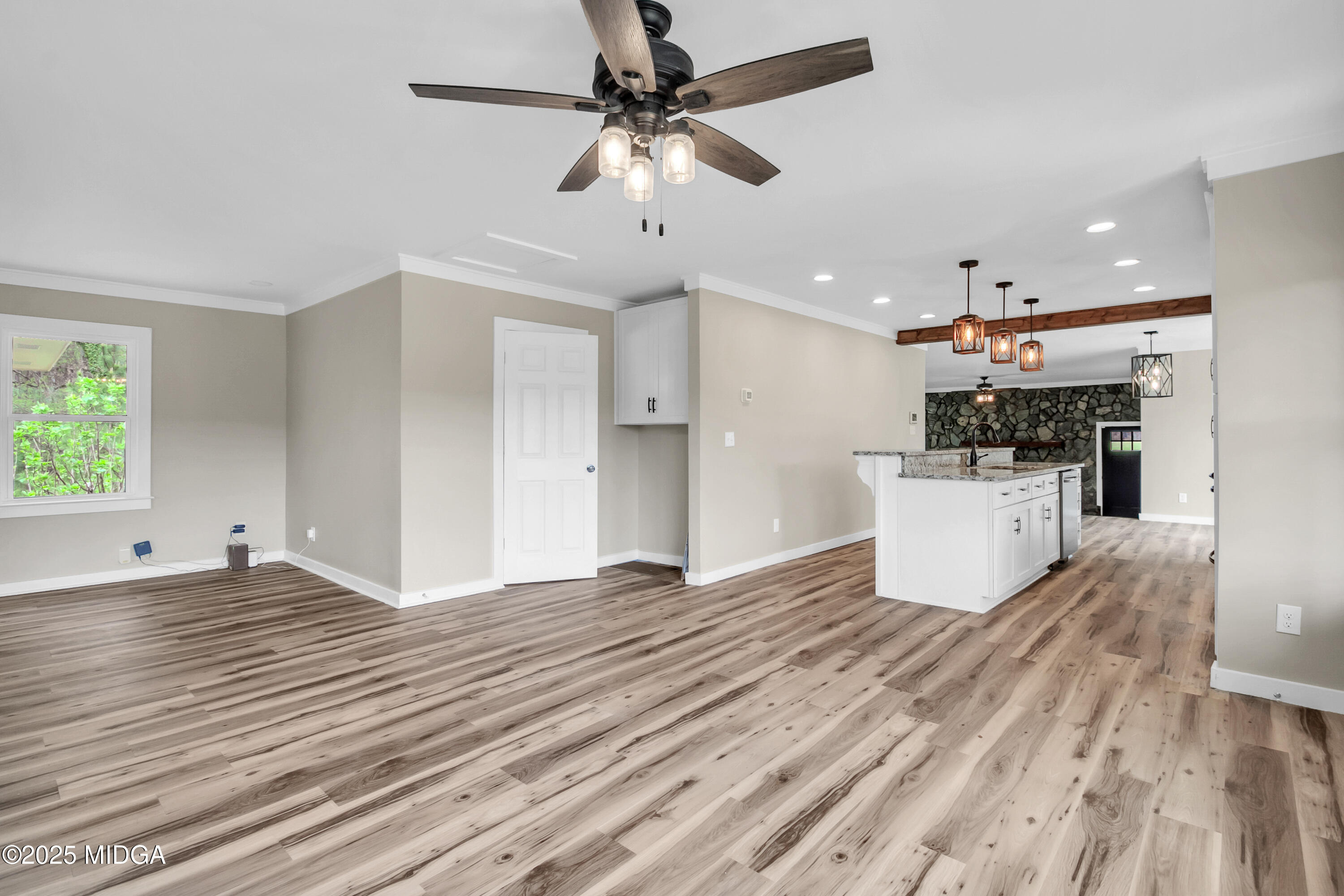 8738 Highway 87 Juliette, GA 31046 - Photo 11 of 36 a view of empty room with wooden floor and ceiling fan