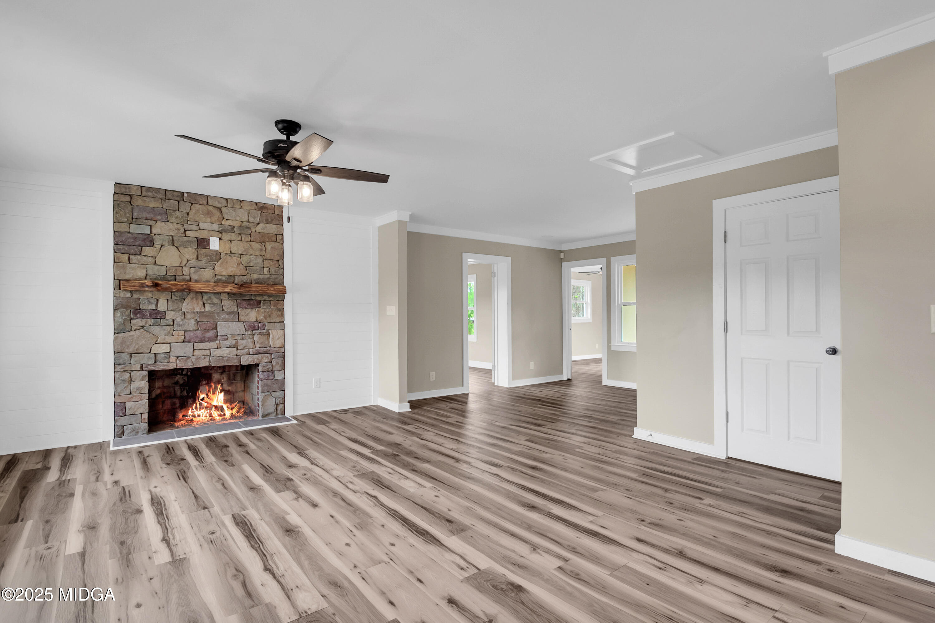 8738 Highway 87 Juliette, GA 31046 - Photo 14 of 36 a view of empty room with wooden floor and fireplace