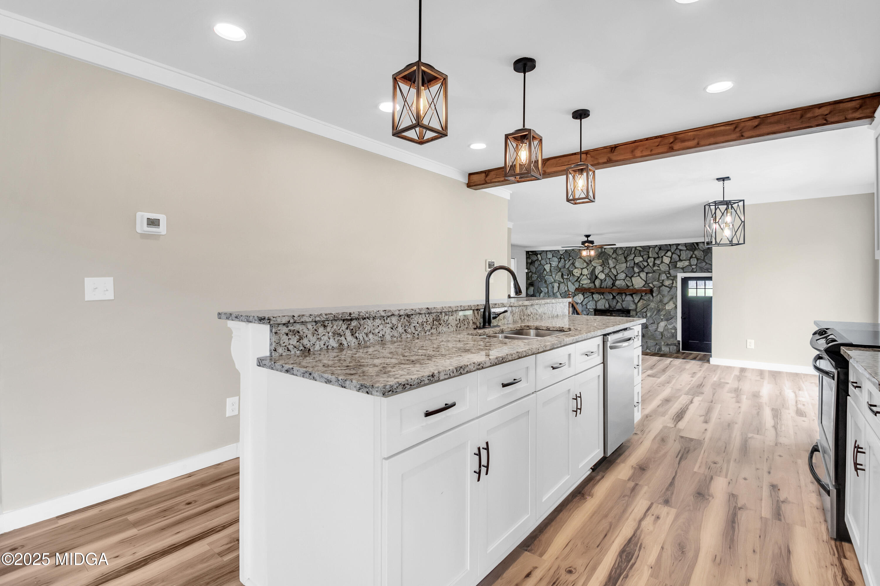 8738 Highway 87 Juliette, GA 31046 - Photo 15 of 36 a kitchen with a stove a sink and a refrigerator